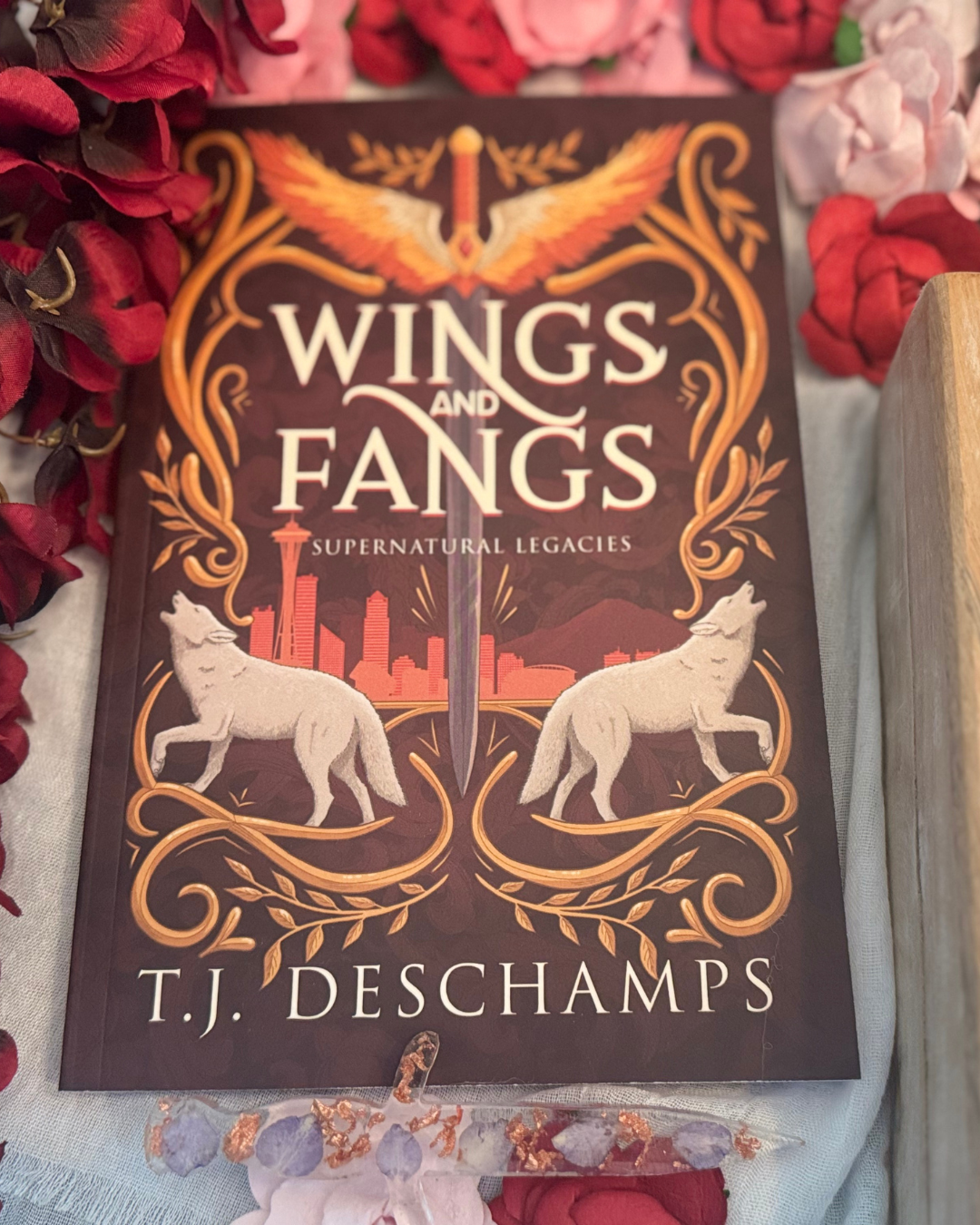 Signed copy of Wings and Fangs by T.J. Deschamps